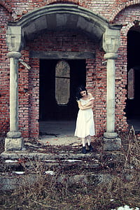 woman standing in between posts thumbnail