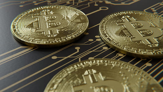 three gold-colored Bitcoins thumbnail