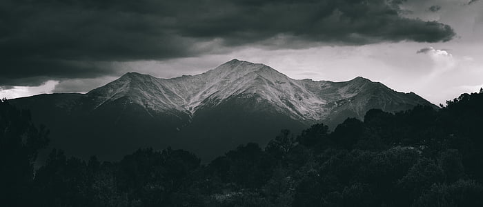 silhouette of trees near mountains thumbnail