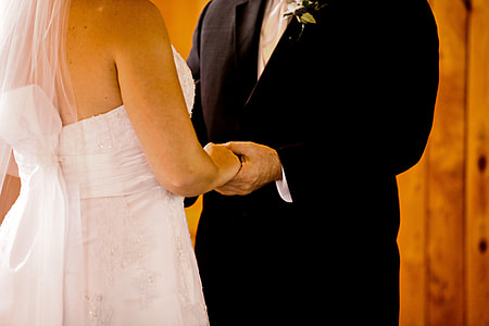 wedding couple holding hands thumbnail