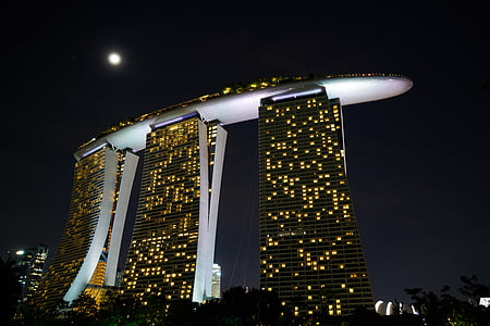 black and gray high-rise building during nighttime thumbnail