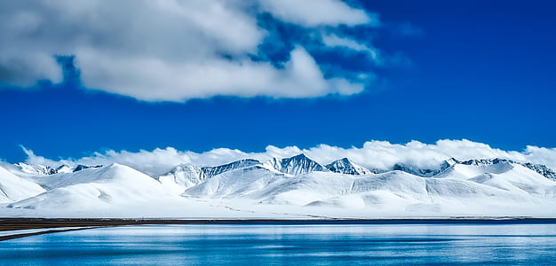 mountain covered in snow at daytime thumbnail