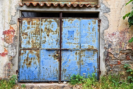 rusted blue steel gate during daytime thumbnail