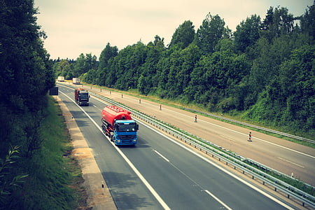 blue and red oil truck on road during daytime thumbnail