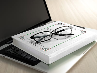 black framed eyeglasses on book thumbnail