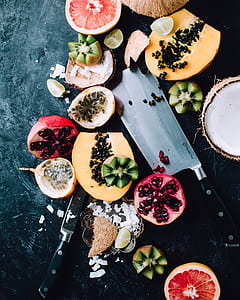 assorted fruit slices with knives thumbnail