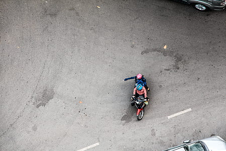 two person riding motorcycle on gray concrete road during daytime thumbnail