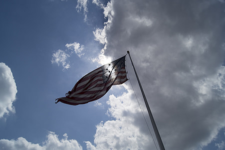low-angle photography of waving flag of USA thumbnail