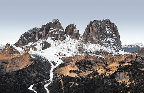 snow covered rocky mountain during daytime thumbnail