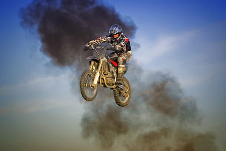 man riding motorcycle on front of smoke thumbnail