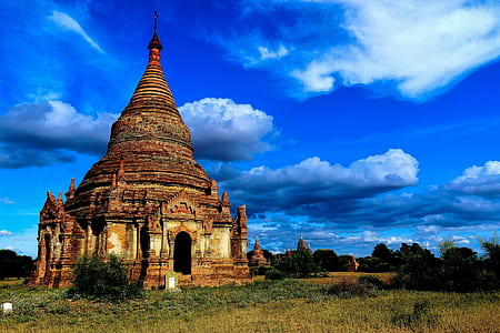 temple near grass field thumbnail