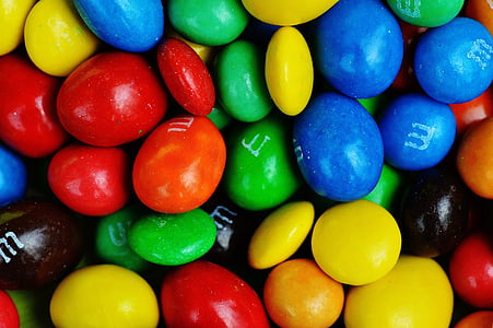 pile of M&M's candies closeup photo thumbnail