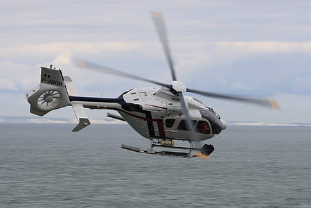 flying white helicopter thumbnail