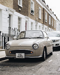 gray coupe on side street thumbnail