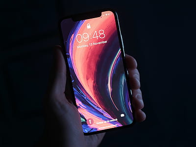 person holding iPhone X thumbnail