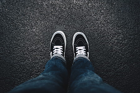person wearing blue jeans standing on ground thumbnail