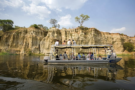 group of people riding boat on body of water during daytime thumbnail