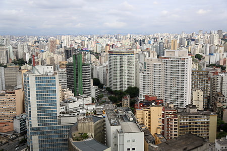 city skyline under white clouds at daytime thumbnail