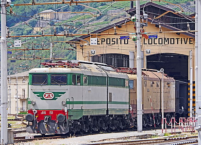 green and gray train in train trail at daytime thumbnail
