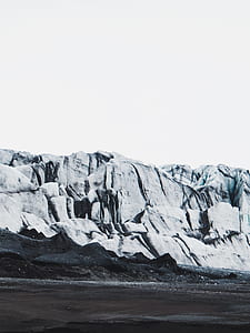 white rugged mountain under white sky at daytime thumbnail