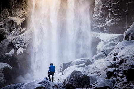 man fronting waterfall thumbnail
