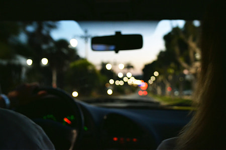 Person driving a car at dusk thumbnail