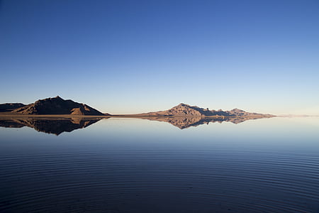 landscape photo of mountain near body of water thumbnail