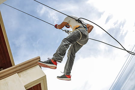Man Wearing Harness Going Down Building thumbnail