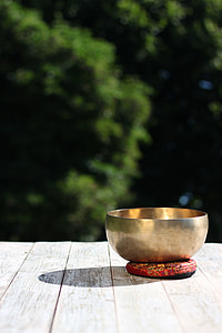 depth of field photograph of brass-color bowl thumbnail