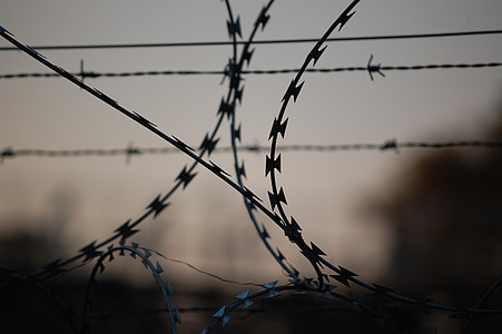 silhouette photography of fence thumbnail