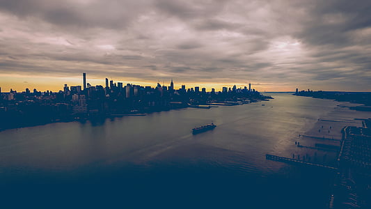 aerial photography of high rise buildings near body of water thumbnail