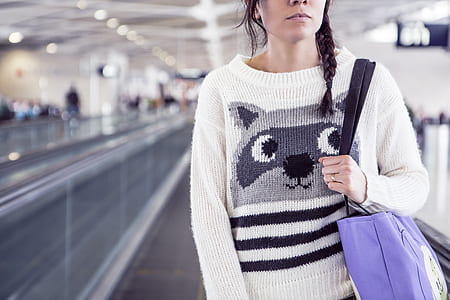woman in white boat-neck sweater thumbnail