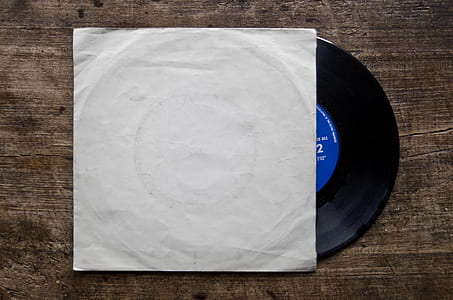 black vinyl record on brown surface thumbnail