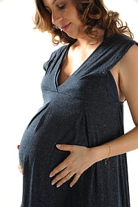 woman holding her belly thumbnail