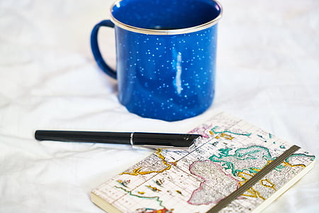 black pen beside coffee mug thumbnail