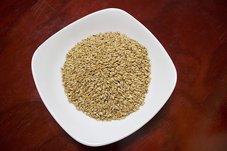 top view photo of brown grains on white ceramic saucer thumbnail
