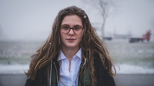 woman in eyeglasses covered with snow thumbnail