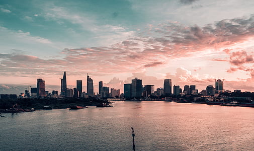 aerial photography of city and body of water thumbnail