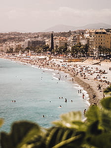 group of people gathering at the beach during daytime thumbnail