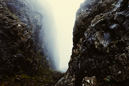 rocky cliff surrounded by fogs thumbnail