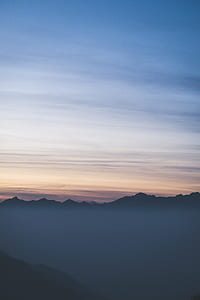 silhouette of mountain under blue sky thumbnail