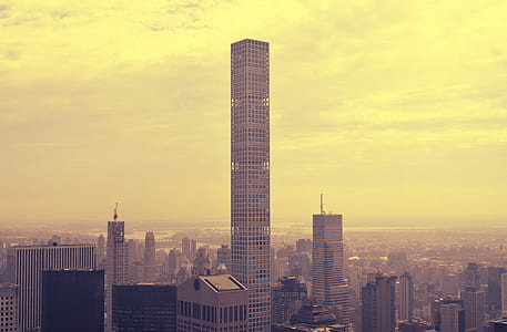 gray concrete buildings during daytime photo thumbnail