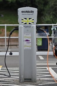 selective focus photography of gray Ecotricity electric highway on black asphalt road thumbnail