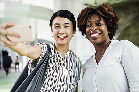 woman taking selfie with another woman thumbnail