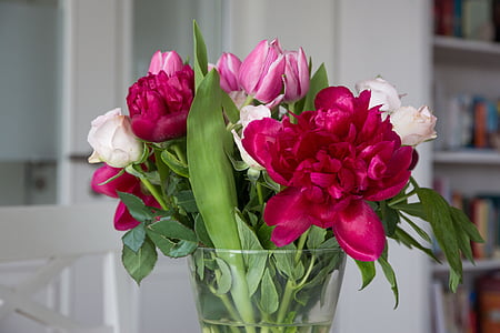 red peonies and white roses in clear glass vase thumbnail