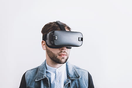 Man wearing virtual reality goggles. thumbnail