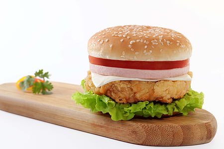 chicken ham burger on brown wooden chopping board thumbnail