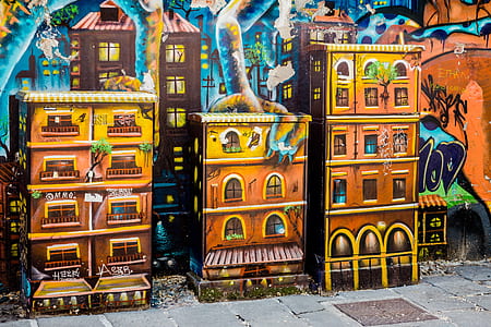 three brown buildings painted wall thumbnail