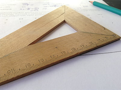 brown wooden measuring tool on white printer ppaer thumbnail