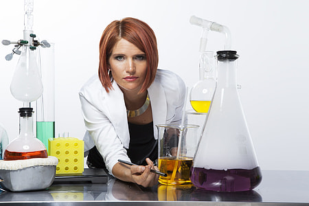 woman standing near table with erlen meyer flask thumbnail